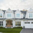 Luxury custom home exterior in Oakville built by Prasada Custom Homes, featuring timeless architecture, white siding, black windows, and refined detailing