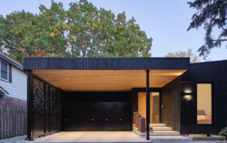Modern custom home exterior featuring sustainable Shou Sugi Ban charred wood siding