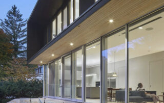 Luxury custom home interior with floor-to-ceiling triple-pane windows for energy efficiency