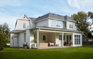 Rear exterior of luxury custom home showcasing sustainable design and outdoor living